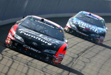 FONTANA, CA - OCTOBER 10:  Kyle Busch, driver of the #18 Z-Line Designs Toyota, leads Joey Logano, driver of the #20 Gamestop Toyota, during the NASCAR Nationwide Series Copart 300 at Auto Club Speedway on October 10, 2009 in Fontana, California.  (Photo by Jason Smith/Getty Images for NASCAR)