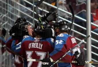 DENVER - OCTOBER 24:  The Colorado Avalanche celebrate a second period goal by TJ Galiardi against the Detroit Red Wings during NHL action at the Pepsi Center on October 24, 2009 in Denver, Colorado.  (Photo by Doug Pensinger/Getty Images)