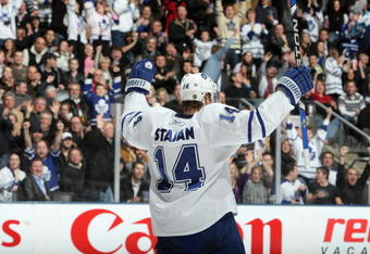 TORONTO - FEBRUARY 21:  Matt Stajan #14 of the Toronto Maple Leafs celebrates during the game against the Vancouver Canucks at Air Canada Centre on February 21, 2009 in Toronto, Ontario. (Photo by Dave Sandford/Getty Images)