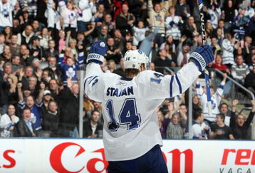 TORONTO - FEBRUARY 21:  Matt Stajan #14 of the Toronto Maple Leafs celebrates during the game against the Vancouver Canucks at Air Canada Centre on February 21, 2009 in Toronto, Ontario. (Photo by Dave Sandford/Getty Images)