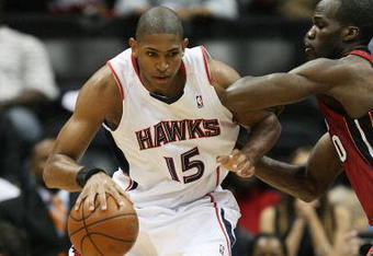 ATLANTA - MAY 03:  Al Horford #15 of the Atlanta Hawks backs down Joel Anthony #50 of the Miami Heat during Game Seven of the Eastern Conference Quarterfinals at Philips Arena on May 3, 2009 in Atlanta, Georgia. The Hawks defeated the Heat 91-78. NOTE TO USER: User expressly acknowledges and agrees that, by downloading and/or using this Photograph, user is consenting to the terms and conditions of the Getty Images License Agreement.  (Photo by Doug Benc/Getty Images)