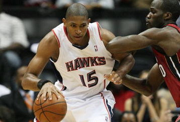 ATLANTA - MAY 03:  Al Horford #15 of the Atlanta Hawks backs down Joel Anthony #50 of the Miami Heat during Game Seven of the Eastern Conference Quarterfinals at Philips Arena on May 3, 2009 in Atlanta, Georgia. The Hawks defeated the Heat 91-78. NOTE TO USER: User expressly acknowledges and agrees that, by downloading and/or using this Photograph, user is consenting to the terms and conditions of the Getty Images License Agreement.  (Photo by Doug Benc/Getty Images)