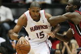 ATLANTA - MAY 03:  Al Horford #15 of the Atlanta Hawks backs down Joel Anthony #50 of the Miami Heat during Game Seven of the Eastern Conference Quarterfinals at Philips Arena on May 3, 2009 in Atlanta, Georgia. The Hawks defeated the Heat 91-78. NOTE TO USER: User expressly acknowledges and agrees that, by downloading and/or using this Photograph, user is consenting to the terms and conditions of the Getty Images License Agreement.  (Photo by Doug Benc/Getty Images)