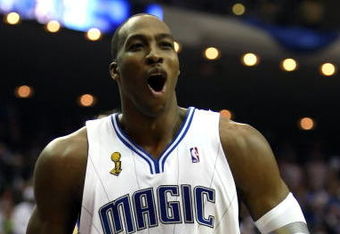 ORLANDO, FL - JUNE 11:  Dwight Howard #12 of the Orlando Magic reatcs in the second quarter of Game Four of the 2009 NBA Finals against the Los Angeles Lakers on June 11, 2009 at Amway Arena in Orlando, Florida.  NOTE TO USER:  User expressly acknowledges and agrees that, by downloading and or using this photograph, User is consenting to the terms and conditions of the Getty Images License Agreement.  (Photo by Elsa/Getty Images)
