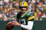 GREEN BAY, WI - OCTOBER 18: Aaron Rodgers #12 of the Green Bay Packers looks for a receiver during a game against the Detroit Lions at Lambeau Field on October 18, 2009 in Green Bay, Wisconsin. The Packers defeated the Lions 26-0. (Photo by Jonathan Daniel/Getty Images)
