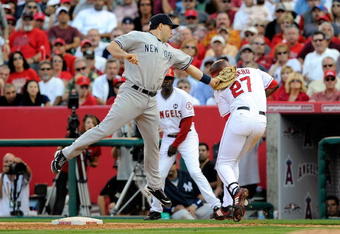 ANAHEIM, CA - OCTOBER 19:  Mark Teixeira #25 of the New York Yankees tags out Vladimir Guerrero #27 of the Los Angeles Angels of Anaheim ending the eigth inning in Game Three of the ALCS during the 2009 MLB Playoffs at Angel Stadium on October 19, 2009 in Anaheim, California.  (Photo by Kevork Djansezian/Getty Images)