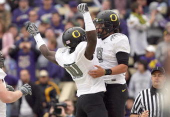SEATTLE - OCTOBER 24:  Wide reciever D.J. Davis #10 and quarterback Jeremiah Masoli #8 of the Oregon Ducks celebrates the touchdown during the game against the Washington Huskies on October 24, 2009 at Husky Stadium in Seattle, Washington. The Ducks defeated the Huskies 43-19. (Photo by Otto Greule Jr/Getty Images)