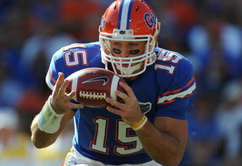 GAINESVILLE, FL - OCTOBER 17: Quarterback Tim Tebow #15 of the Florida Gators bobbles a snap against the University of Arkansas Razorbacks October 17, 2009 at Ben Hill Griffin Stadium in Gainesville, Florida.  (Photo by Al Messerschmidt/Getty Images)