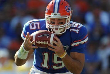 GAINESVILLE, FL - OCTOBER 17: Quarterback Tim Tebow #15 of the Florida Gators bobbles a snap against the University of Arkansas Razorbacks October 17, 2009 at Ben Hill Griffin Stadium in Gainesville, Florida.  (Photo by Al Messerschmidt/Getty Images)