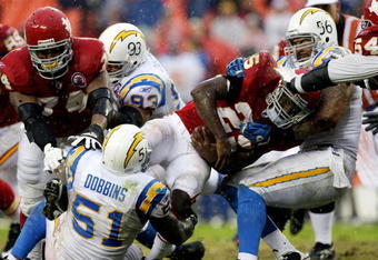 KANSAS CITY, MO - OCTOBER 25:  Running back Jamaal Charles #25 of the Kansas City Chiefs is tackled by Tim Dobbins # 51 and Shawne Merriman #56 of the San Diego Chargers during the game on October 25, 2009 at Arrowhead Stadium in Kansas City, Missouri.  (Photo by Jamie Squire/Getty Images)