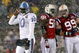 FOXBORO - OCTOBER 18: Vince Young #10 of the Tennessee Titans leaves the field as Pierre Woods #58 and Mike Wright #99 of the New England Patriots converse at Gillette Stadium on October 18, 2009 in Foxboro, Massachusetts. The Patriots won 59-0. (Photo by Jim Rogash/Getty Images)