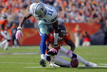 DENVER - OCTOBER 04:  Champ Bailey #24 of the Denver Broncos breaks up a pass intended for Roy Williams #11 of the Dallas Cowboys during NFL action at Invesco Field at Mile High on October 4, 2009 in Denver, Colorado. The Broncos defeated the Cowboys 17-10.  (Photo by Doug Pensinger/Getty Images)