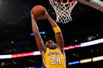LOS ANGELES, CA - OCTOBER 27:  Kobe Bryant #24 of the Los Angeles Lakers goes up for a dunk in front of Rasual Butler #45 of the Los Angeles Clippers in the first quarter of the season opening game at Staples Center on October 27, 2009 in Los Angeles, California.  NOTE TO USER: User expressly acknowledges and agrees that, by downloading and or using this photograph, User is consenting to the terms and conditions of the Getty Images License Agreement. Mandatory Copyright Notice: Copyright 2009 NBAE  (Photo by Kevork Djansezian/Getty Images)