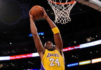 LOS ANGELES, CA - OCTOBER 27:  Kobe Bryant #24 of the Los Angeles Lakers goes up for a dunk in front of Rasual Butler #45 of the Los Angeles Clippers in the first quarter of the season opening game at Staples Center on October 27, 2009 in Los Angeles, California.  NOTE TO USER: User expressly acknowledges and agrees that, by downloading and or using this photograph, User is consenting to the terms and conditions of the Getty Images License Agreement. Mandatory Copyright Notice: Copyright 2009 NBAE  (Photo by Kevork Djansezian/Getty Images)