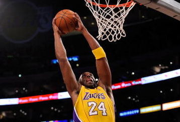 LOS ANGELES, CA - OCTOBER 27:  Kobe Bryant #24 of the Los Angeles Lakers goes up for a dunk in front of Rasual Butler #45 of the Los Angeles Clippers in the first quarter of the season opening game at Staples Center on October 27, 2009 in Los Angeles, California.  NOTE TO USER: User expressly acknowledges and agrees that, by downloading and or using this photograph, User is consenting to the terms and conditions of the Getty Images License Agreement. Mandatory Copyright Notice: Copyright 2009 NBAE  (Photo by Kevork Djansezian/Getty Images)