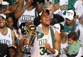 BOSTON - JUNE 17:  Paul Pierce #34 of the Boston Celtics celebrates with the NBA Finals MVP trophy after defeating the Los Angeles Lakers in Game Six of the 2008 NBA Finals on June 17, 2008 at TD Banknorth Garden in Boston, Massachusetts. NOTE TO USER: User expressly acknowledges and agrees that, by downloading and/or using this Photograph, user is consenting to the terms and conditions of the Getty Images License Agreement.  (Photo by Kevin C. Cox/Getty Images)
