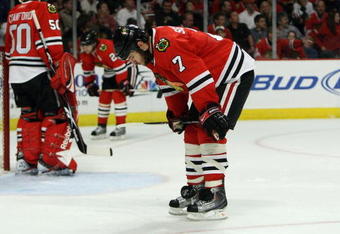 CHICAGO - MAY 24:  (L-R) Corey Crawford #50, Duncan Keith #2 and Brent Seabrook #7 of the Chicago Blackhawks look on dejected as they stand on the ice against the Detroit Red Wings during Game Four of the Western Conference Championship Round of the 2009 Stanley Cup Playoffs on May 24, 2009 at the United Center in Chicago, Illinois.  (Photo by Jonathan Daniel/Getty Images)