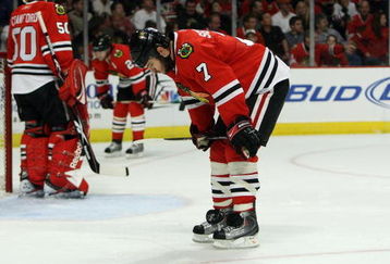 CHICAGO - MAY 24:  (L-R) Corey Crawford #50, Duncan Keith #2 and Brent Seabrook #7 of the Chicago Blackhawks look on dejected as they stand on the ice against the Detroit Red Wings during Game Four of the Western Conference Championship Round of the 2009 Stanley Cup Playoffs on May 24, 2009 at the United Center in Chicago, Illinois.  (Photo by Jonathan Daniel/Getty Images)