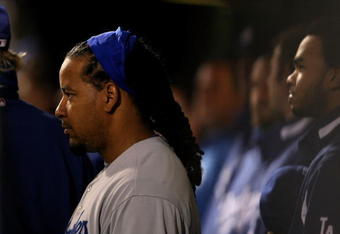 PHILADELPHIA - OCTOBER 18:  Manny Ramirez #99 of the Los Angeles Dodgers stands in the dugout during their game against the Philadelphia Phillies in Game Three of the NLCS during the 2009 MLB Playoffs at Citizens Bank Park on October 18, 2009 in Philadelphia, Pennsylvania.  (Photo by Nick Laham/Getty Images)