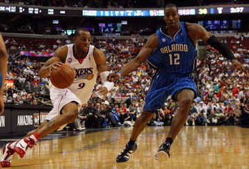 PHILADELPHIA - APRIL 26:  Andre Iguodala #9 of the Philadelphia 76ers drives against Dwight Howard #12 of the Orlando Magic during Game Four of the Eastern Conference Quarterfinals during the 2009 NBA Playoffs at the Wachovia Center on April 26, 2009 in Philadelphia, Pennsylvania. NOTE TO USER: User expressly acknowledges and agrees that, by downloading and/or using this Photograph, user is consenting to the terms and conditions of the Getty Images License Agreement.  (Photo by Jim McIsaac/Getty Images)