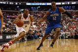 PHILADELPHIA - APRIL 26:  Andre Iguodala #9 of the Philadelphia 76ers drives against Dwight Howard #12 of the Orlando Magic during Game Four of the Eastern Conference Quarterfinals during the 2009 NBA Playoffs at the Wachovia Center on April 26, 2009 in Philadelphia, Pennsylvania. NOTE TO USER: User expressly acknowledges and agrees that, by downloading and/or using this Photograph, user is consenting to the terms and conditions of the Getty Images License Agreement.  (Photo by Jim McIsaac/Getty Images)