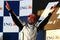 MELBOURNE, AUSTRALIA - MARCH 29:  Jenson Button of Great Britain and Brawn GP celebrates on the podium after winning the Australian Formula One Grand Prix at the Albert Park Circuit on March 29, 2009 in Melbourne, Australia.  (Photo by Clive Mason/Getty Images)