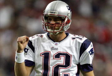 ATLANTA - OCTOBER 09:  Quarterback Tom Brady #12 of the New England Patriots pumps his fist after a touchdown during the first half of their game against the Atlanta Falcons on October 9, 2005 at the Georgia Dome in Atlanta, Georgia.  (Photo by Streeter Lecka/Getty Images)