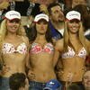 SYDNEY - OCTOBER 6:  Swimsuit fans including Jennifer Hawkins of Australia (second from right who went on to become Miss Universe 2004) show their wares during the 2002 NRL Grand Final played between the Sydney Roosters and the New Zealand Warriors held at Telstra Stadium in Sydney, Australia on October 6, 2002. The Roosters defeated the Warriors 30-8. (Photo by Adam Pretty/Getty Images)