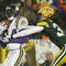GREEN BAY, WI - JANUARY 9:  Wide receiver Randy Moss #84 of the Minnesota Vikings catches a second half touchdown pass in front of cornerback Al Harris #31 of the Green Bay Packers during the NFC wild-card game at Lambeau Field January 9, 2005 in Green Bay, Wisconsin. The Vikings defeated the Packers 31-17.  (Photo by Brian Bahr/Getty Images)