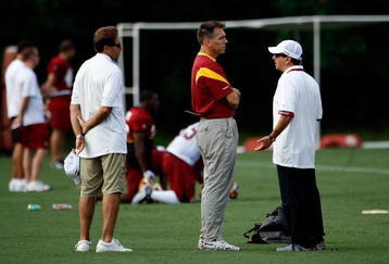 ASHBURN, VA - JULY 30:  Washington Redskins Head Coach Jim Zorn (C) talks with owner Daniel Snyder (R) as Executive Vice President for Football Operations Vinny Cerrato (L) looks on during the first day of training camp July 30, 2009 in Ashburn, Virginia.  (Photo by Win McNamee/Getty Images)
