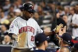 NEW YORK - OCTOBER 09:  Delmon Young #21 of the Minnesota Twins celebrates after being driven home on a triple by Brendan Harris #23 in the sixth inning against the New York Yankees in Game Two of the ALDS during the 2009 MLB Playoffs at Yankee Stadium on October 9, 2009 in the Bronx borough of New York City.  (Photo by Jim McIsaac/Getty Images)