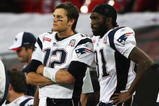 LONDON, ENGLAND - OCTOBER 25:  Tom Brady (#12) and Randy Moss (#81) of the New England Patriots look on during the NFL International Series match between New England Patriots and Tampa Bay Buccaneers at Wembley Stadium on October 25, 2009 in London, England. This is the third occasion where a regular season NFL match has been played in London.  (Photo by Elsa/Getty Images)