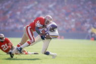 SAN FRANCISCO - OCTOBER 30:  Defenseman Ronnie Lott #42 of the San Francisco 49ers makes a tackle during a NFL game against the Minnesota Vikings at Candlestick Park on October 30, 1988 in San Francisco, California.  The Niners defeated the Vikings 24-21.  (Photo by Otto Greule Jr/Getty Images)