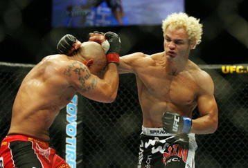 CHICAGO- OCTOBER 25: Josh Koscheck (R) punches Thiago Alves in a Welterweight bout  at UFC's Ultimate Fight Night at Allstate Arena on October 25, 2008 in Chicago, Illinois. (Photo by Tasos Katopodis/Getty Images)