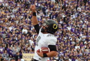SEATTLE - OCTOBER 24:  Quarterback Jeremiah Masoli #8 of the Oregon Ducks celebrates his touchdwon against the Washington Huskies on October 24, 2009 at Husky Stadium in Seattle, Washington. The Ducks defeated the Huskies 43-19. (Photo by Otto Greule Jr/Getty Images)
