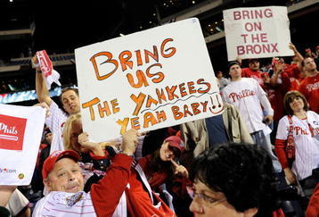 PHILADELPHIA - OCTOBER 21:  Fans of the Philadelphia Phillies hold up signs which call for the Phillies to play against the New York Yankees in the World Series after the Phillies advanced to the series with their 10-4 against the Los Angeles Dodgers in Game Five of the NLCS during the 2009 MLB Playoffs at Citizens Bank Park on October 21, 2009 in Philadelphia, Pennsylvania.  (Photo by Jeff Zelevansky/Getty Images)