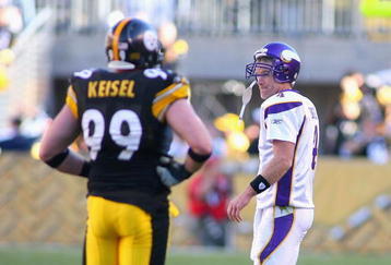 PITTSBURGH - OCTOBER 25: Brett Favre #4  of the Minnesota Vikings walks off the field past Brett Keisel #99 of the Pittsburgh Steelers after Keyaron Fox #57 (not shown) intercepted  Favre and returned it for a touchdown at Heinz Field on October 25, 2009 in Pittsburgh, Pennsylvania.  (Photo by Rick Stewart/Getty Images)
