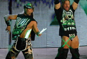 LAS VEGAS - AUGUST 24:  Wrestlers and tag team partners Shawn Michaels (L) and Triple H are introduced during the WWE Monday Night Raw show at the Thomas & Mack Center August 24, 2009 in Las Vegas, Nevada.  (Photo by Ethan Miller/Getty Images)