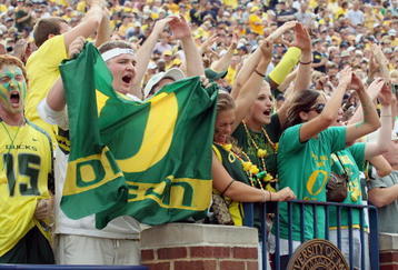 ANN ARBOR, MI - SEPTEMBER 08:  Oregon Ducks fans cheer on their team during the game against the Michigan Wolverines on September 8, 2007 at Michigan Stadium in Ann Arbor, Michigan.  The Ducks defeated the Wolverines 39-7. (Photo By Gregory Shamus/Getty Images)