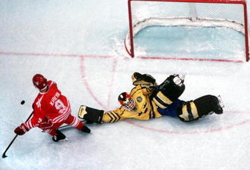 27 FEB 1994:  GOALKEEPER TOMMY SALO OF SWEDEN STOPS CANADA's PAUL KARIYA IN AN OVERTIME SHOOTOUT, TO WIN THE HOCKEY FINAL, 3-2,  AT THE 1994 WINTER OLYMPICS IN LILLEHAMMER.  Mandatory Credit: Chris Cole/ALLSPORT