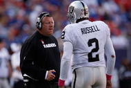 EAST RUTHERFORD, NJ - OCTOBER 11:  Head Coach Tom Cable and JaMarcus Russell #2 of the Oakland Raiders talk in between plays during the game on October 11, 2009 at Giants Stadium in East Rutherford, New Jersey.  (Photo by Jared Wickerham/Getty Images)