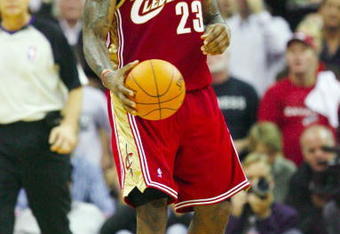 CLEVELAND - OCTOBER 27:  LeBron James #23 of the Cleveland Cavaliers reacts during the season opener against the Boston Celtics at Quicken Loans Arena on October 27, 2009 in Cleveland, Ohio.  NOTE TO USER: User expressly acknowledges and agrees that, by downloading and or using this photograph, User is consenting to the terms and conditions of the Getty Images License Agreement. (Photo by Gregory Shamus/Getty Images)