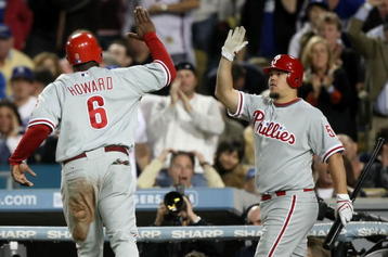 LOS ANGELES, CA - OCTOBER 13:  Ryan Howard #6 of the Philadelphia Phillies celebrates with teammate Joe Blanton #56 after Howard scored on a wild-pitch in the sixth inning of Game Four of the National League Championship Series during the 2008 MLB playoffs on October 13, 2008 at Dodger Stadium in Los Angeles, California.  (Photo by Jed Jacobsohn/Getty Images)