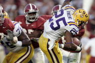 TUSCALOOSA, AL - NOVEMBER 12:  Justin Vincent #25 of Louisiana State University is tripped by Anthony Madison #9 of the University of Alabama on November 12, 2005 at at Bryant-Denny Stadium in Tuscaloosa, Alabama.  LSU defeated Alabama 16-13 in overtime.   (Photo by Chris Graythen/Getty Images) 