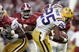 TUSCALOOSA, AL - NOVEMBER 12:  Justin Vincent #25 of Louisiana State University is tripped by Anthony Madison #9 of the University of Alabama on November 12, 2005 at at Bryant-Denny Stadium in Tuscaloosa, Alabama.  LSU defeated Alabama 16-13 in overtime.   (Photo by Chris Graythen/Getty Images) 