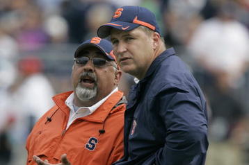 STATE COLLEGE, PA - SEPTEMBER 12: Head coach Doug Marrone, right, of the Syracuse Orangemen talks with assistant head coach Bob Casullo as they watch the game during the second half of their game against the Penn State Nittany Lions at Beaver Stadium  September 12, 2009 in State College, Pennsylvania. Penn State won 28-7. (Photo by Chris Gardner/Getty Images)