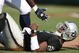 OAKLAND, CA - SEPTEMBER 27: JaMarcus Russell #2 of the Oakland Raiders is helped up after getting hit against the Denver Broncos on September 27, 2009 during an NFL game at the Oakland-Alameda County Coliseum in Oakland, California. (Photo by Jed Jacobsohn/Getty Images)