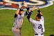 ANAHEIM, CA - OCTOBER 20:  Alex Rodriguez #13 (L) of the New York Yankees celebrates with teammate Derek Jeter #2 after Rodriguez hit a two run home run during the fifth inning in Game Four of the ALCS against the Los Angeles Angels of Anaheim during the 2009 MLB Playoffs at Angel Stadium on October 20, 2009 in Anaheim, California.  (Photo by Jacob de Golish/Getty Images)
