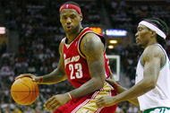 CLEVELAND - OCTOBER 27:  LeBron James #23 of the Cleveland Cavaliers drives the ball against Marquis Daniels #7 of the Boston Celtics during the season opener at Quicken Loans Arena on October 27, 2009 in Cleveland, Ohio.  NOTE TO USER: User expressly acknowledges and agrees that, by downloading and or using this photograph, User is consenting to the terms and conditions of the Getty Images License Agreement. (Photo by Gregory Shamus/Getty Images)