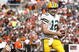 CLEVELAND, OH - OCTOBER 25: Aaron Rodgers #12 of the Green Bay Packers runs by Kaluka Maiava #56 of the Cleveland Browns at Cleveland Browns Stadium on October 25, 2009 in Cleveland, Ohio. (Photo by Matt Sullivan/Getty Images)